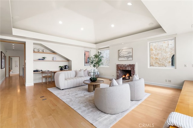 1554 E Oceanfront, Newport Beach, CA 92661 - living room featuring a brick fireplace, light wood finished floors, recessed lighting, baseboards, and built in features