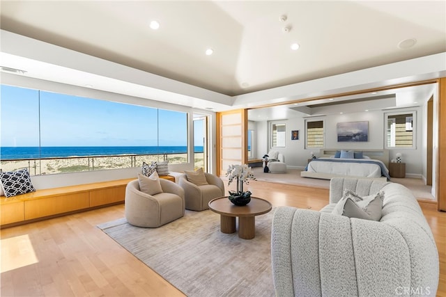 1554 E Oceanfront, Newport Beach, CA 92661 - living room featuring wood finished floors, healthy amount of natural light, recessed lighting, and a water view