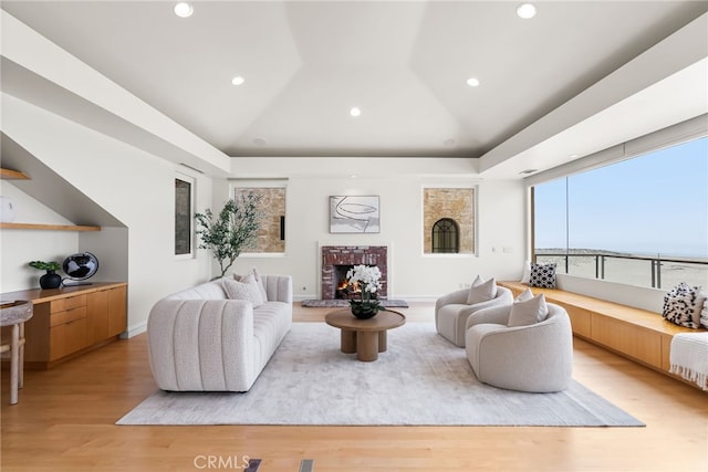 1554 E Oceanfront, Newport Beach, CA 92661 - living room with light wood-style flooring, a fireplace, vaulted ceiling, and recessed lighting
