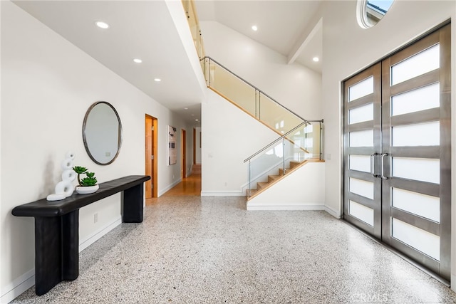 1554 E Oceanfront, Newport Beach, CA 92661 - entrance foyer featuring baseboards, speckled floor, french doors, stairs, and recessed lighting
