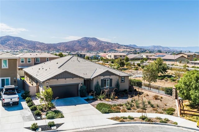 24505 Legion Ct, Menifee, CA 92584 - single story home featuring concrete driveway, a mountain view, an attached garage, stucco siding, and a residential view