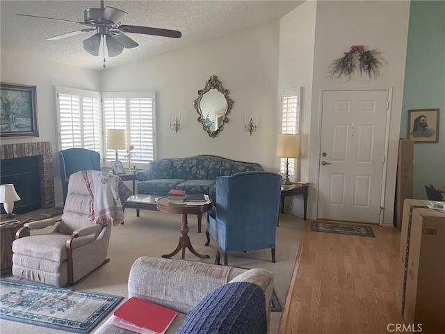10815 Cherry Hls, Cherry Valley, CA 92223 - living room featuring a textured ceiling, a ceiling fan, wood finished floors, lofted ceiling, and a brick fireplace