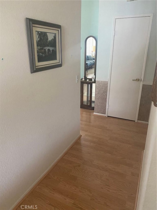 10815 Cherry Hls, Cherry Valley, CA 92223 - corridor featuring wood finished floors and baseboards