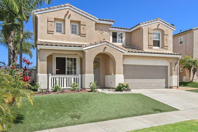 2656 Table Rock Ave, Chula Vista, CA 91914 - mediterranean / spanish home featuring a tile roof, an attached garage, concrete driveway, stucco siding, and covered porch