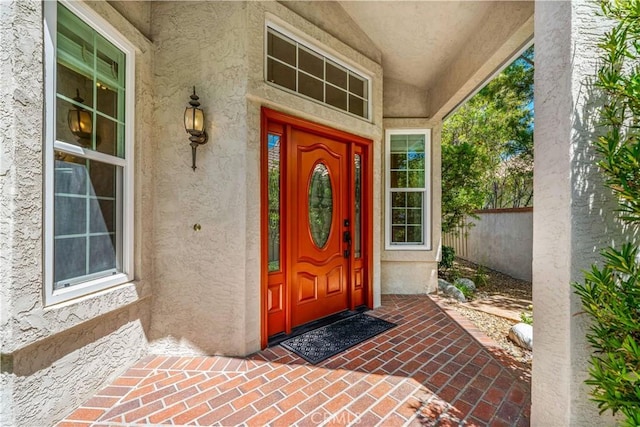 40686 Via Jalapa, Murrieta, CA 92562 - view of exterior entry with stucco siding and fence