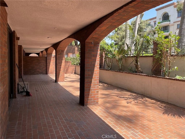 view of patio featuring fence