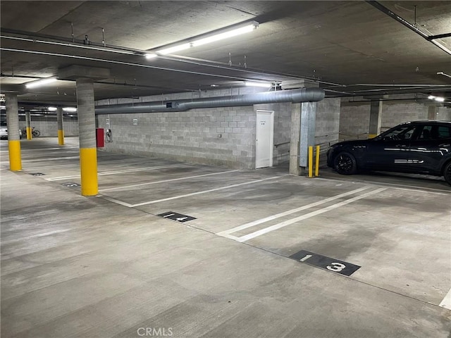 parking deck featuring concrete block wall