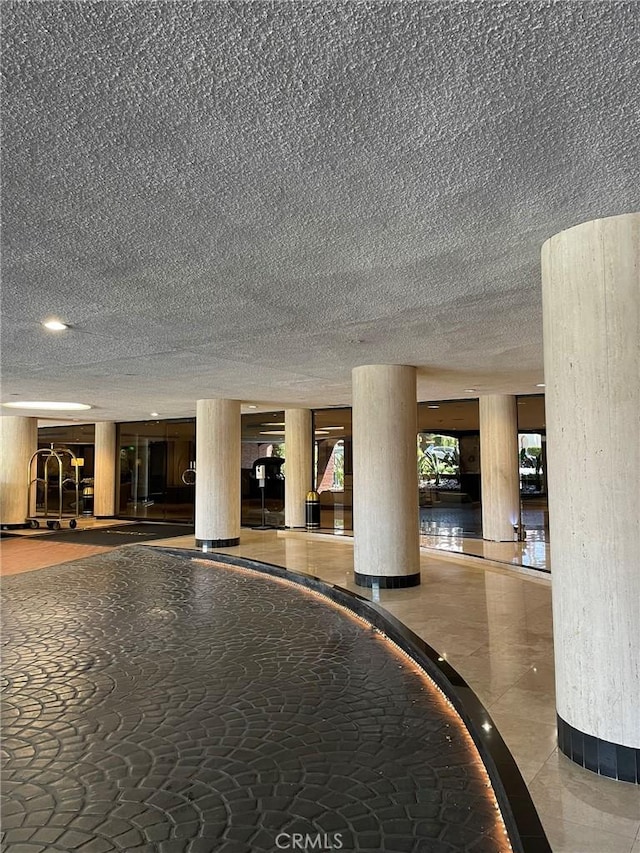 common area featuring a textured ceiling