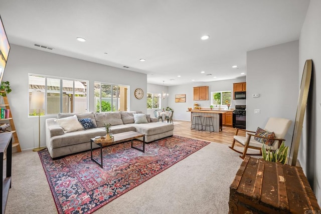 341 Dun Blazer Way, Fallbrook, CA 92028 - living room with recessed lighting, a chandelier, and light carpet
