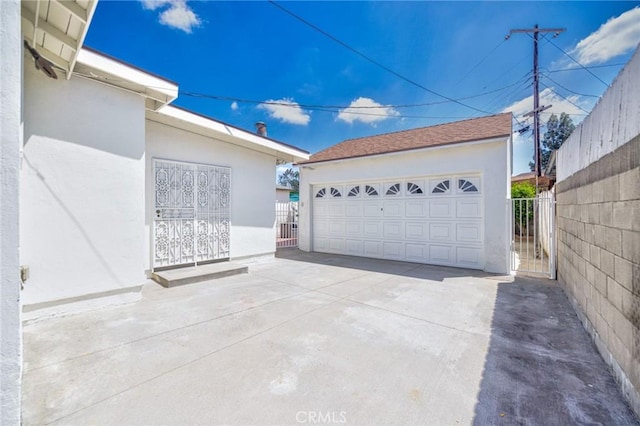 8873 Coolhurst Dr, Pico Rivera, CA 90660 - detached garage featuring a gate and fence