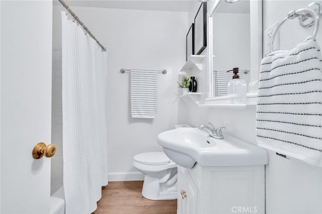 8873 Coolhurst Dr, Pico Rivera, CA 90660 - full bath featuring vanity, toilet, and wood finished floors