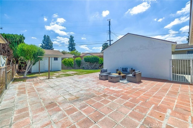 8873 Coolhurst Dr, Pico Rivera, CA 90660 - view of patio / terrace with an outdoor hangout area, a fenced backyard, an outdoor structure, and a shed