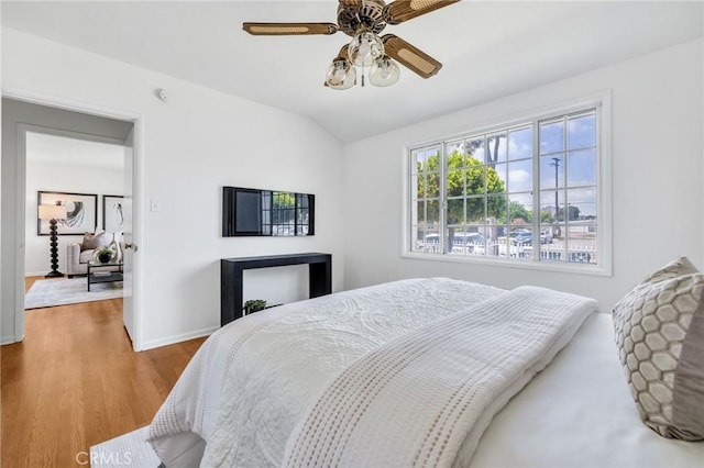 8873 Coolhurst Dr, Pico Rivera, CA 90660 - bedroom with wood finished floors, baseboards, lofted ceiling, and ceiling fan