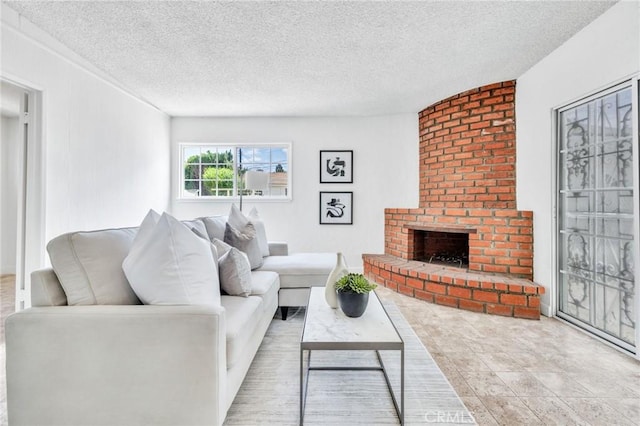 8873 Coolhurst Dr, Pico Rivera, CA 90660 - living area featuring a fireplace and a textured ceiling