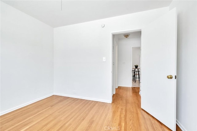 8873 Coolhurst Dr, Pico Rivera, CA 90660 - spare room with light wood-type flooring and baseboards