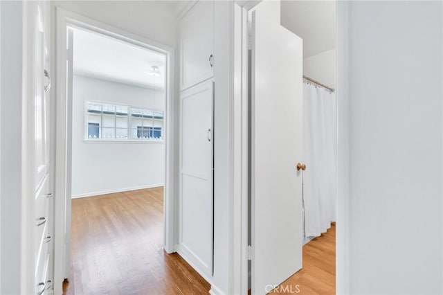 8873 Coolhurst Dr, Pico Rivera, CA 90660 - corridor with wood finished floors and baseboards