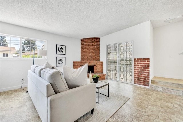 8873 Coolhurst Dr, Pico Rivera, CA 90660 - living area featuring a fireplace, a textured ceiling, and baseboards