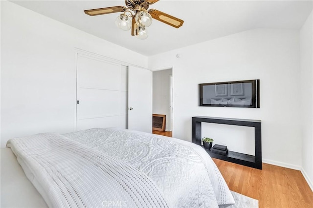8873 Coolhurst Dr, Pico Rivera, CA 90660 - bedroom with baseboards, light wood-style flooring, ceiling fan, and a closet