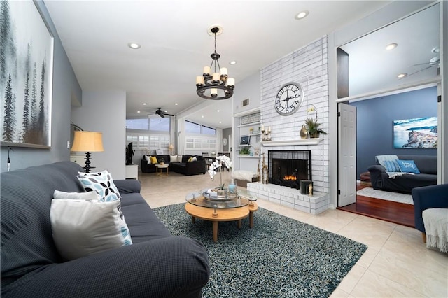 5158 Elderhall Ave, Lakewood, CA 90712 - living room with tile patterned floors, ceiling fan, a brick fireplace, recessed lighting, and a chandelier