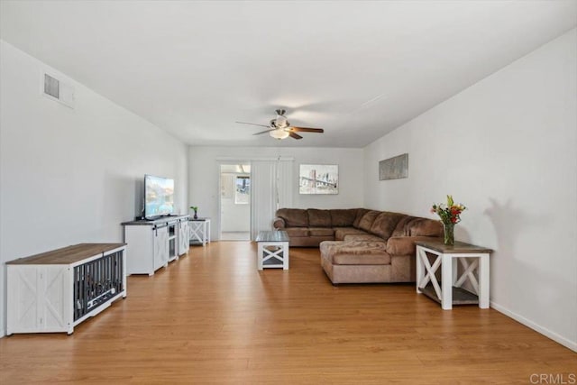 1278 E Madison Ave Unit D, El Cajon, CA 92021 - living room with ceiling fan and light wood-style floors