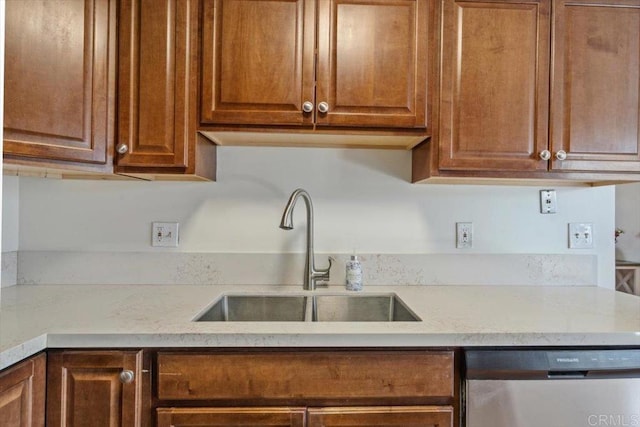 1278 E Madison Ave Unit D, El Cajon, CA 92021 - kitchen with dishwasher, light stone counters, and brown cabinetry