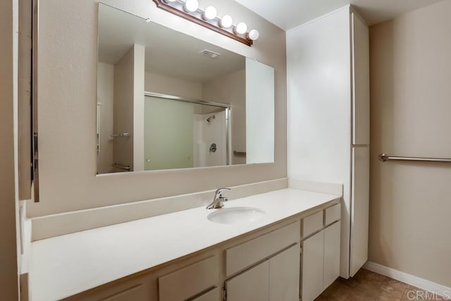 4379 Albatross Way, Oceanside, CA 92057 - bathroom with a stall shower, vanity, baseboards, and tile patterned flooring