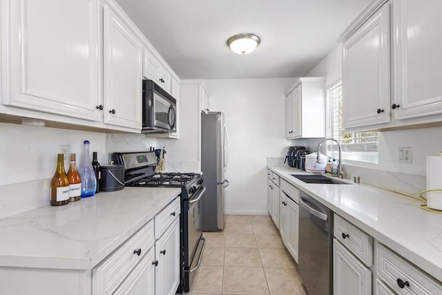5510 Adelaide Ave Unit 1, San Diego, CA 92115 - kitchen featuring stainless steel appliances, a sink, white cabinets, and light stone counters