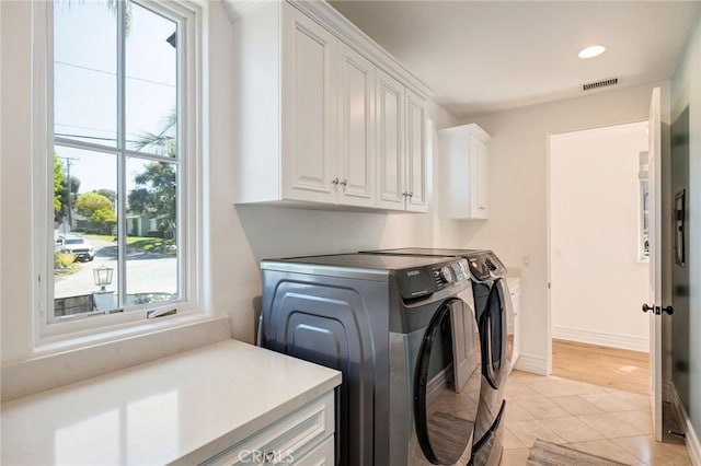 737 35th St, Manhattan Beach, CA 90266 - washroom with cabinet space, washing machine and clothes dryer, light tile patterned floors, and recessed lighting