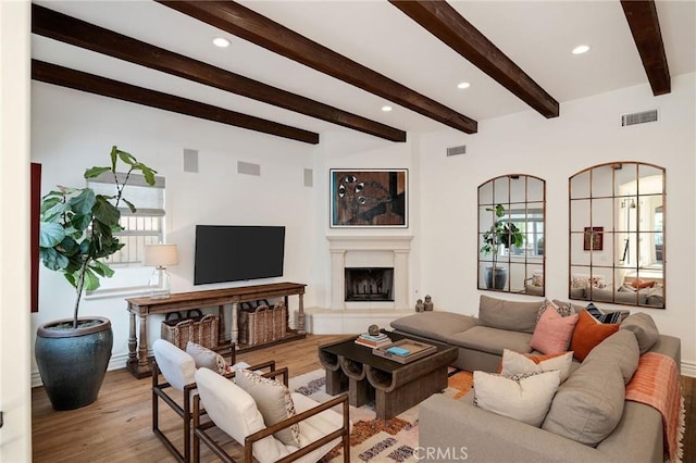 737 35th St, Manhattan Beach, CA 90266 - living area featuring wood finished floors, beamed ceiling, a fireplace with raised hearth, and recessed lighting