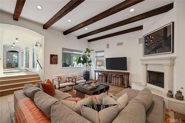 737 35th St, Manhattan Beach, CA 90266 - living room featuring arched walkways, wood finished floors, recessed lighting, healthy amount of natural light, and beam ceiling