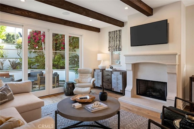 737 35th St, Manhattan Beach, CA 90266 - living room featuring wood finished floors, healthy amount of natural light, a fireplace, beam ceiling, and recessed lighting