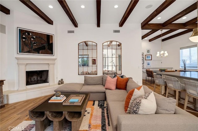 737 35th St, Manhattan Beach, CA 90266 - living area with a chandelier, recessed lighting, wood finished floors, beamed ceiling, and a high end fireplace