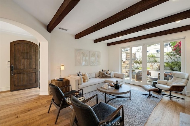 737 35th St, Manhattan Beach, CA 90266 - living room with arched walkways, light wood-style flooring, beamed ceiling, baseboards, and recessed lighting