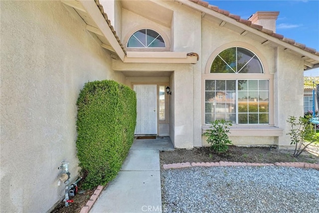 12820 Pan Am Blvd, Moreno Valley, CA 92553 - view of exterior entry with stucco siding and a tile roof