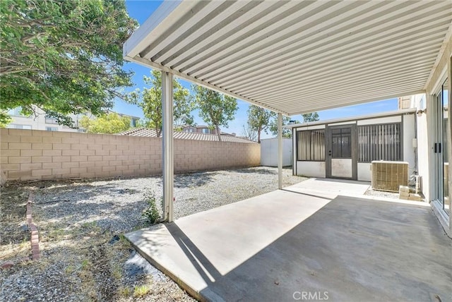 12820 Pan Am Blvd, Moreno Valley, CA 92553 - view of patio with a fenced backyard and cooling unit