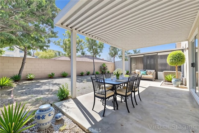 12820 Pan Am Blvd, Moreno Valley, CA 92553 - view of patio with a fenced backyard, outdoor dining space, and outdoor lounge area