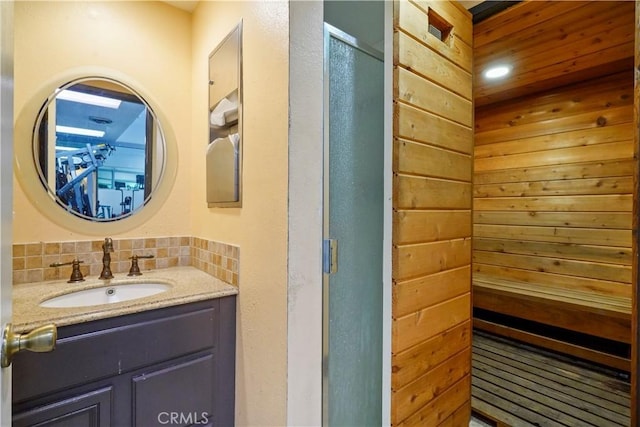 22100 Burbank Blvd Unit 150F, Woodland Hills, CA 91367 - bathroom with backsplash, vanity, a shower stall, and a sauna / steam room