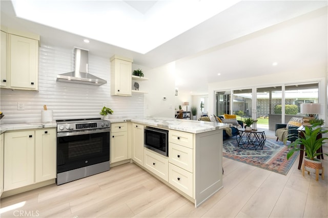 kitchen with wall chimney exhaust hood, electric stove, built in microwave, a peninsula, and backsplash