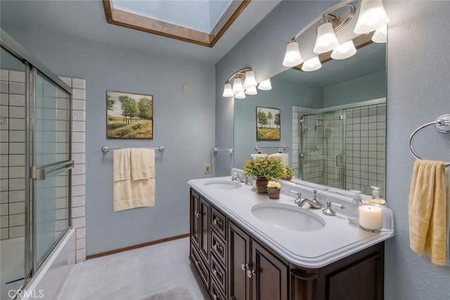 full bath featuring double vanity and bath / shower combo with glass door