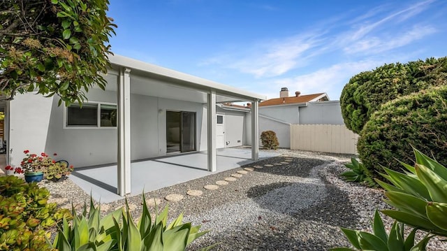 3317 Buena Hills Dr, Oceanside, CA 92056 - rear view of property featuring a patio, fence, and stucco siding