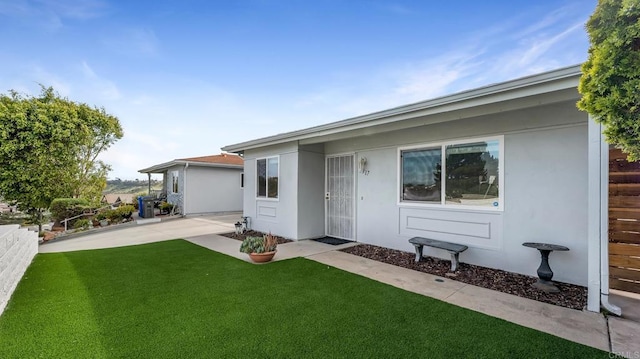 3317 Buena Hills Dr, Oceanside, CA 92056 - back of property featuring stucco siding and a patio