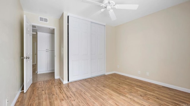 3317 Buena Hills Dr, Oceanside, CA 92056 - unfurnished bedroom with light wood-style flooring, baseboards, a closet, and a ceiling fan