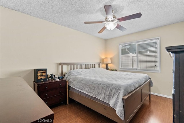19853 Drasin Dr, Canyon Country, CA 91351 - bedroom with wood finished floors, a textured ceiling, baseboards, and ceiling fan