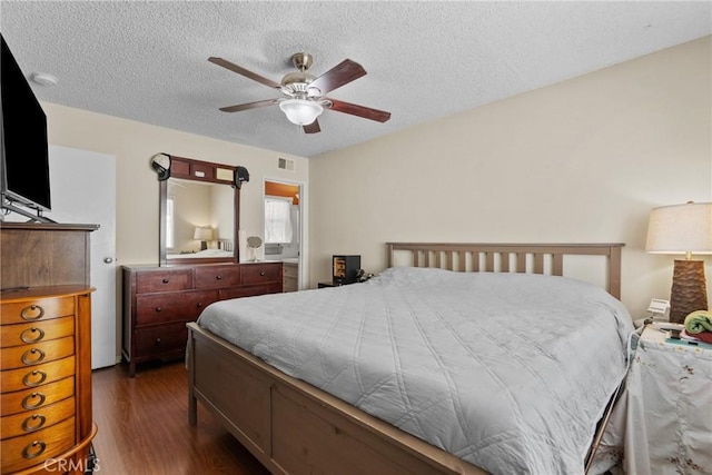 19853 Drasin Dr, Canyon Country, CA 91351 - bedroom featuring dark wood-style flooring, a textured ceiling, and a ceiling fan