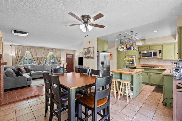 19853 Drasin Dr, Canyon Country, CA 91351 - dining space featuring light tile patterned floors, ceiling fan, and a textured ceiling