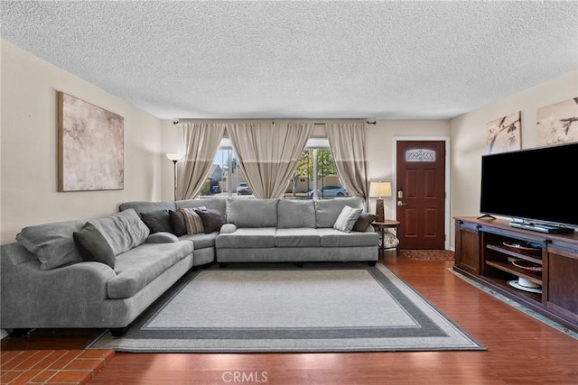 19853 Drasin Dr, Canyon Country, CA 91351 - living room featuring a textured ceiling and dark wood-type flooring