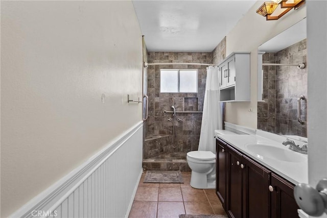 19853 Drasin Dr, Canyon Country, CA 91351 - bathroom featuring tiled shower, toilet, vanity, and tile patterned flooring