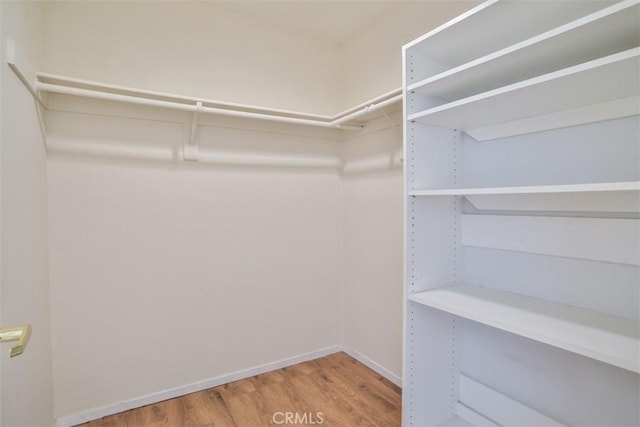 111 Greenfield, Irvine, CA 92614 - spacious closet featuring wood finished floors