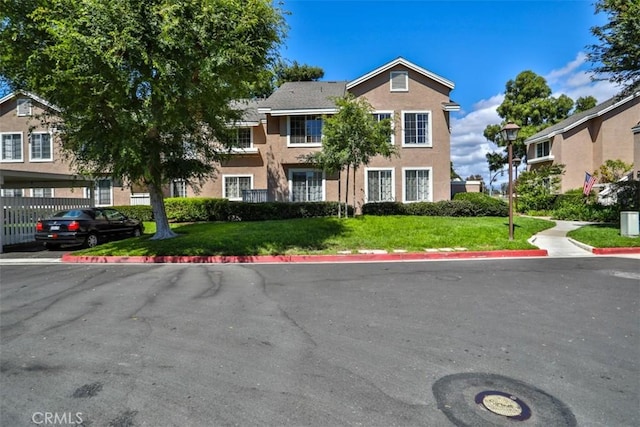 111 Greenfield, Irvine, CA 92614 - view of front of home with stucco siding and a front lawn