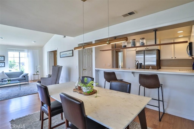 111 Greenfield, Irvine, CA 92614 - dining area with wood finished floors and vaulted ceiling